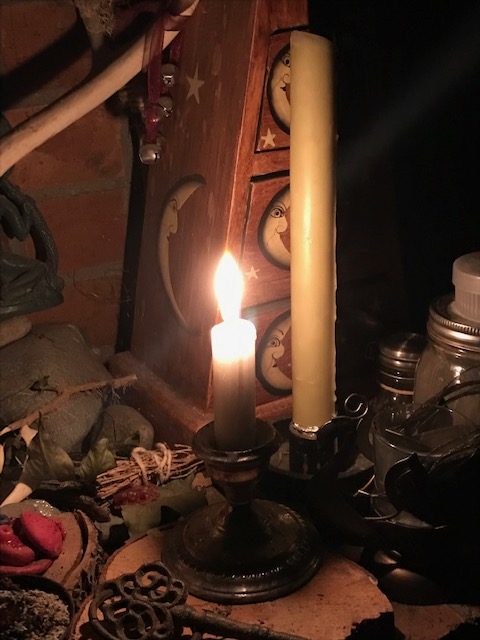 Candle burning on altar